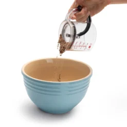 Selbstreinigender Messbecher
